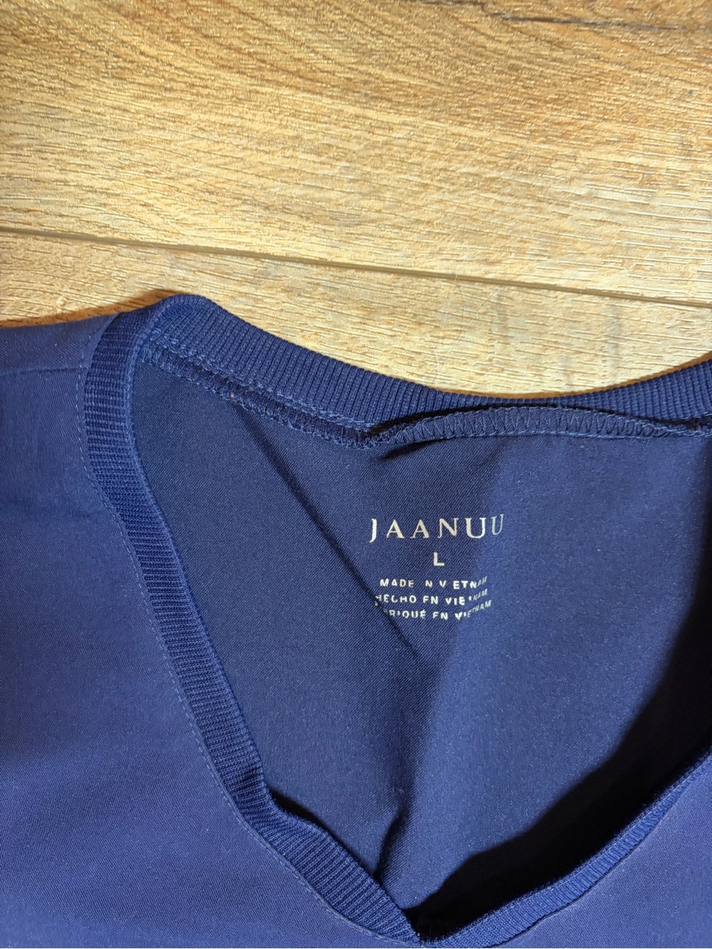 Jaanuu Women's Helia V-Neck Scrub Top in the color Midnight Navy - Picture 4 of 7
